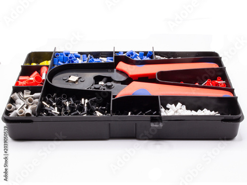 Tableau sur toile a professional wire crimper with red and blue handles placed in a black plastic