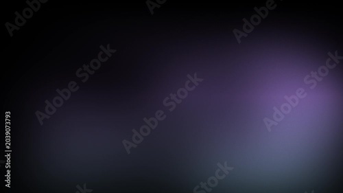 Animation abstract soft gradient light leaks loop motion background on black background. Blurry purple and blue light spots on black background.