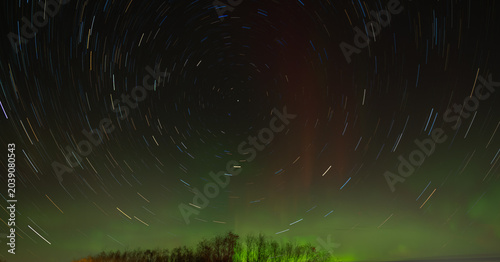 Star trails with northern lights in the background
