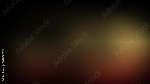Animation abstract soft gradient light leaks loop motion background on black background. Blurry abstract background with orange glow.