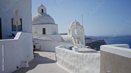 Tableau sur toile White domed coastal village with curved parapets and terraces defocused background outdoor; background backdrop copyspace calm