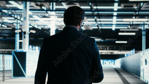 Photos Writing code, tablet closeup and engineer in data center compiling software patches to fix bugs, Running programming script, device application and IT professional in server farm, camera B