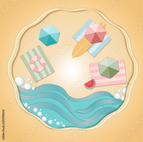 Colorful beach accessories on sandy background with waves  