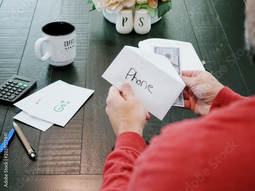 фотографія Personal Finance Budgeting Cash Stuffing Envelopes Using Physical Currency to Li
