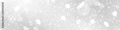 A dense shower of bright white snow particles and bokeh lights on a transparent checkered background.