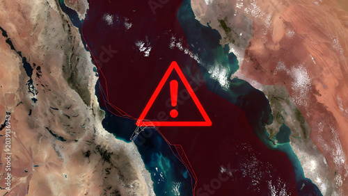 Satellite view of the Strait of Hormuz with a red warning symbol and digital lines. Concept of geopolitical tension, oil supply risks, maritime security, and global trade instability in the Gulf.