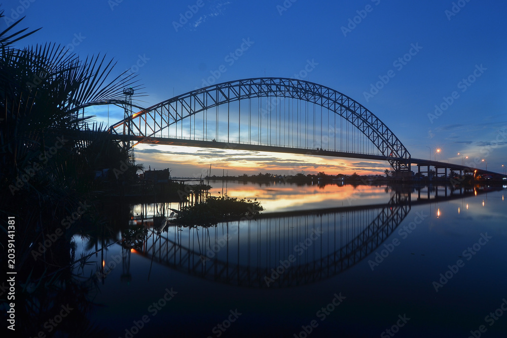 Fototapeta premium A bridge in South Kalimantan, Indonesia, at sunset.