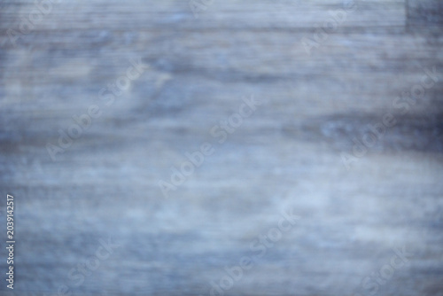 Canvas Print A blurry, out-of-focus close-up shot showing the textured surface of a rustic gr