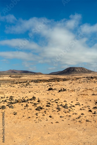 Wide view of Lanzarote’s desert landscape with volcanic hills and stark island beauty