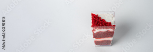 Tableau sur toile A layered cake in a cup with white and red layers, featuring creamy, sweet filling and moist texture, perfect for individual dessert servings or indulgent treats