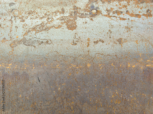 Scratched rusty industrial metal plate backdrop