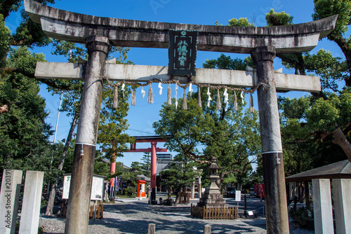 Stone Torii of Ogaki Hachiman Shrine, this shinto shrine rebuilt in the 1950s ,with orange red torii on the back