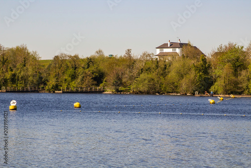 A designated swimming area with marker buoys and boudary lines in a small bay in Lower Lough Erne