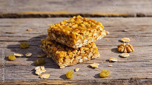 oats honey and dry fruits bar on wooden background.ai 