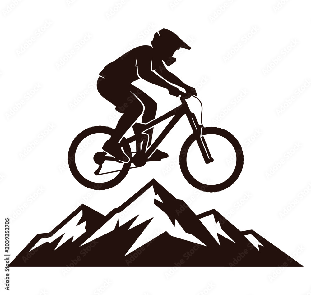 Naklejka premium cyclist riding bike on mountain peak landscape silhouette