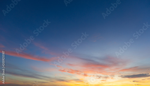 Vibrant Colorful Sunset Sky with Dramatic Clouds,A breathtaking view of a vibrant sunset sky filled with dramatic streaks of orange, pink, and purple clouds, creating a peaceful and inspiring.