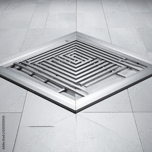 Geometric metal floor grate with a maze-like design