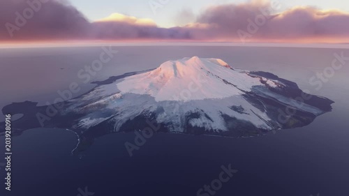 Circular aerial view snow at sunset of Heard Island and McDonald Islands. Australia