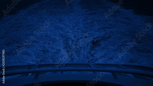 View Behind Ship At Night Making Big Waves
