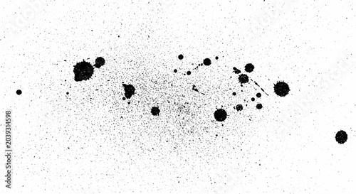 Foto Ink spots on white paper surface.