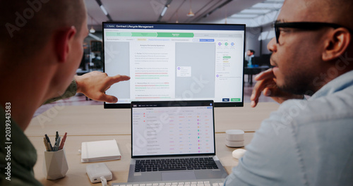 Foto Contract Manager Reviews Digital Agreements Using Software
