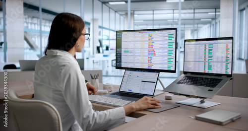 Young Woman Medical Coding Specialist Reviews Billing Data