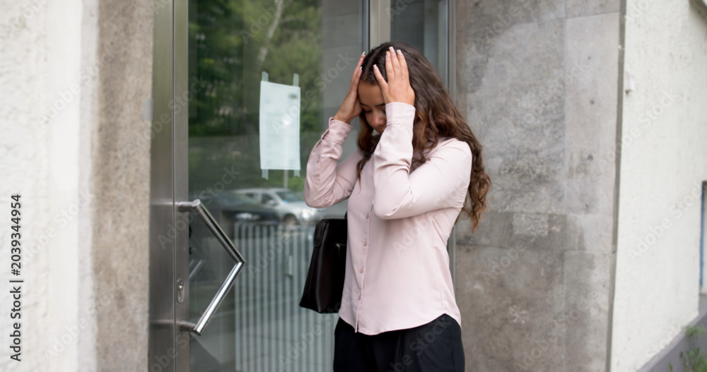 Fototapeta premium Sad Woman Stands Outside Her Door
