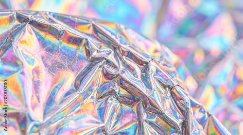 close-up of crumpled holographic foil sheet with rainbow colors