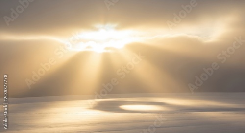 Golden Sunbeams Pierce Through Clouds Above Serene Landscape