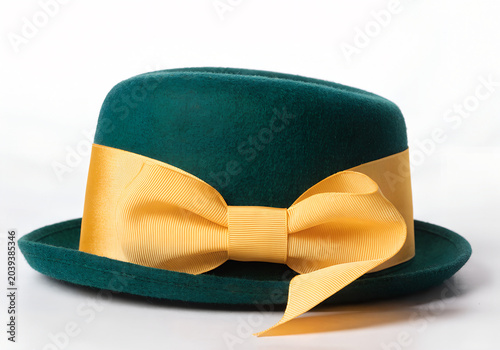 Green felt hat with a yellow ribbon bow