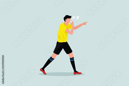 Fotografía A male sports referee in yellow blows the whistle and points to the point where a player is fouled or warned of a foul in a football match
