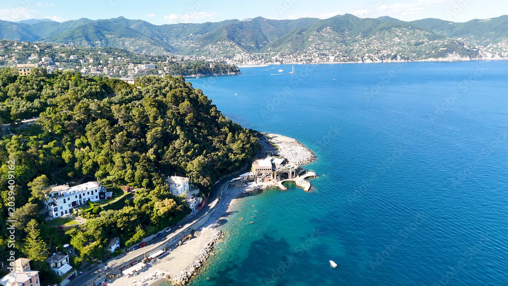 Fototapeta premium Aerial View of Lush Green Hills and Turquoise Mediterranean Sea in Italy