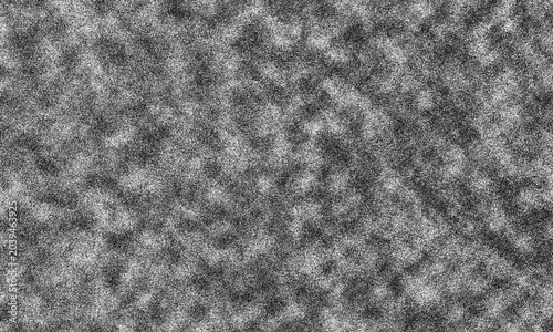 Obraz na plátne A grayscale image of a textured surface with a grainy pattern and varying shades
