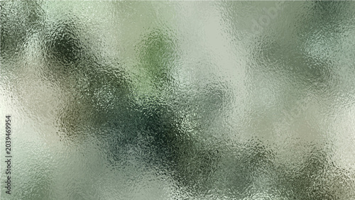 Fotografi Abstract blurred texture of frosted glass with soft green and grey hues, suggesting a subtle, ethereal, or obscured view of nature beyond the surface