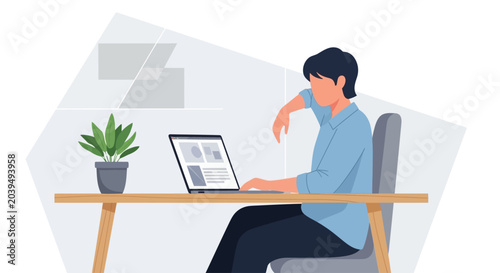 Photos Man sitting at desk with laptop.