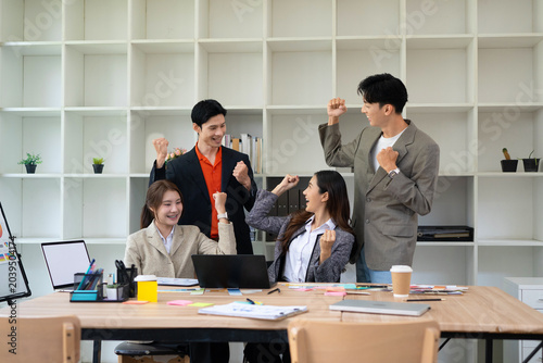 Happy, business people and winning with applause for project completion, done or finished in office. Excited, group or team clapping with flare or documents in air for success or productive workplace