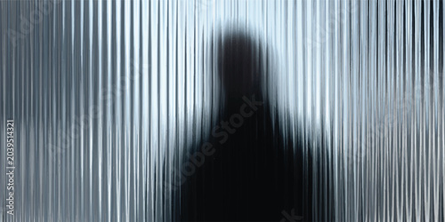 Silhouette of a person standing behind frosted ribbed glass with silhouette abstract obscured vertical background distorted interior presence security minimalist refraction structure