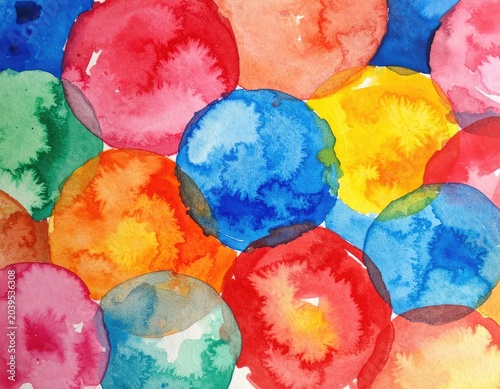 A vibrant watercolor painting featuring a multitude of overlapping circles in various bright colors.