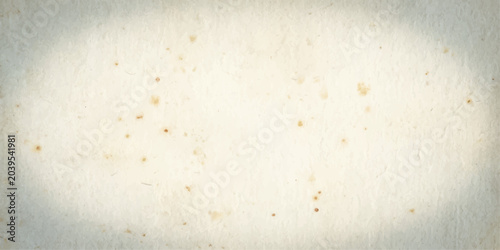 Foto A textured, aged parchment paper background with subtle spots and an oval vignette effect, evoking a sense of history and antique documents