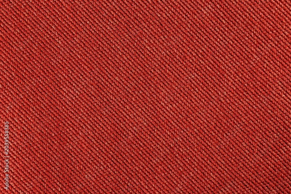 Fototapeta premium Close up background of red denim fabric texture with diagonal pattern