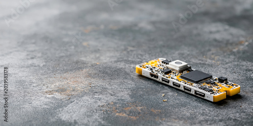 Smart city microcontroller board on concrete surface showing electronic components and ports