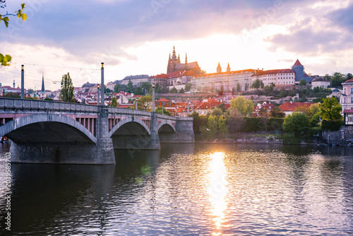 Fotografie Prague Castle at Sunset Viewed Across the Vltava River