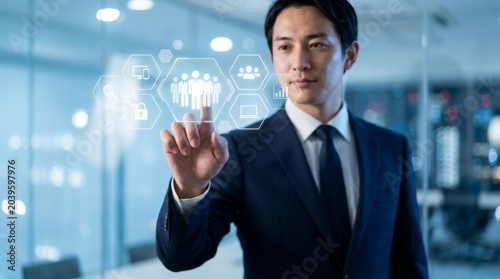 Businessman touching futuristic digital interface, employee engagement icons in glowing hexagons on blue background.
