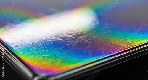 Close-up of iridescent holographic surface with intricate patterns