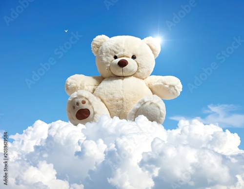Giant teddy on clouds