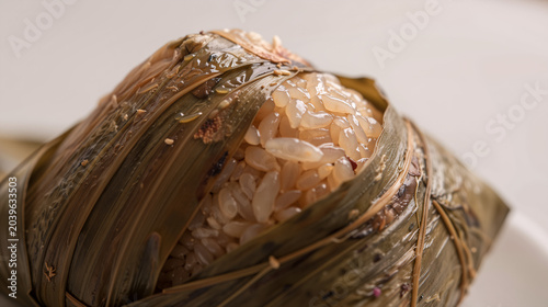 Traditional Asian Sticky Rice Dumpling Wrapped in Bamboo Leaves Macro Food Photo