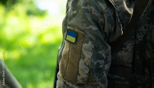 Close-up of a brave Ukrainian defender in military gear, symbol of national pride and resistance