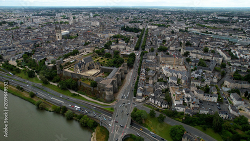 Aerial view beside the old town above the city Angers in France, on a cloudy noon in early summer.
