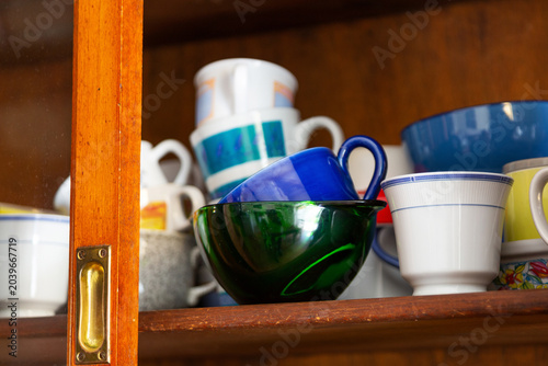 Breakfast cups in an old cabinet