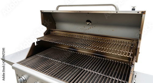 A stainless steel barbecue grill with its lid open sits on an outdoor patio surface.